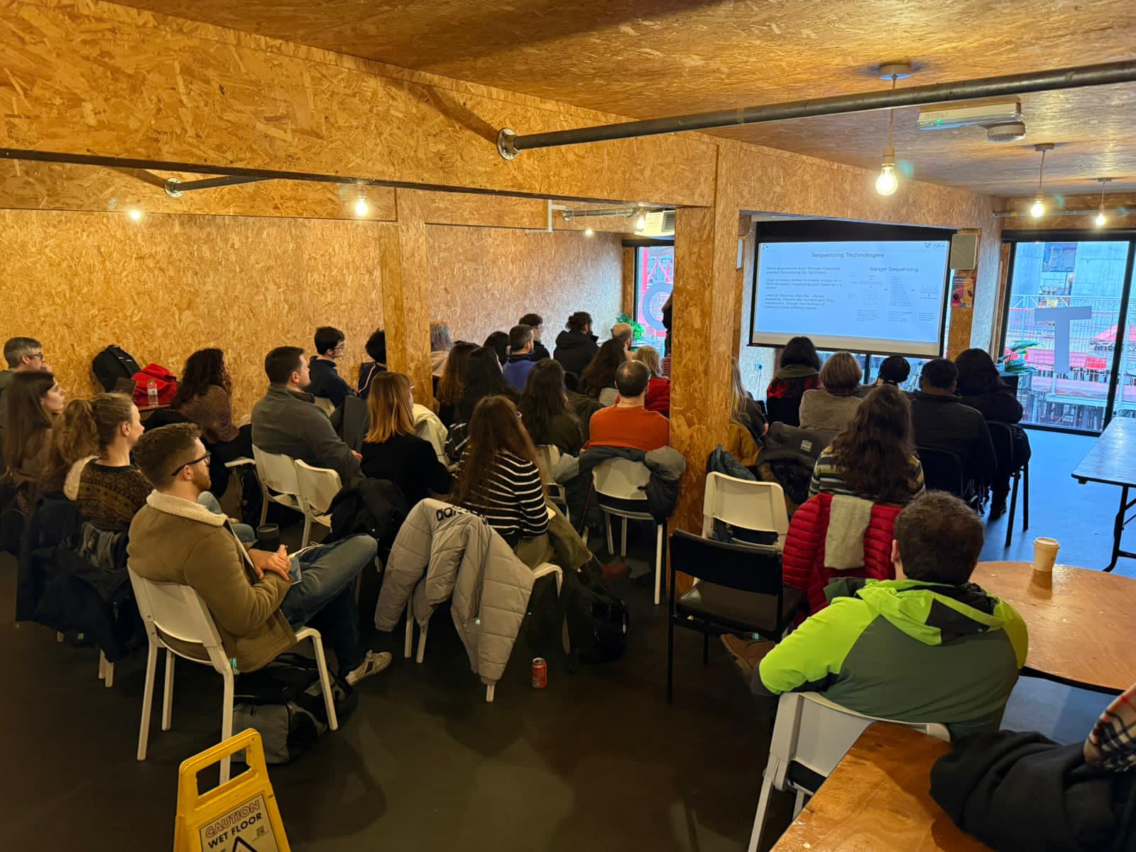 Image of people seated at a workshop.